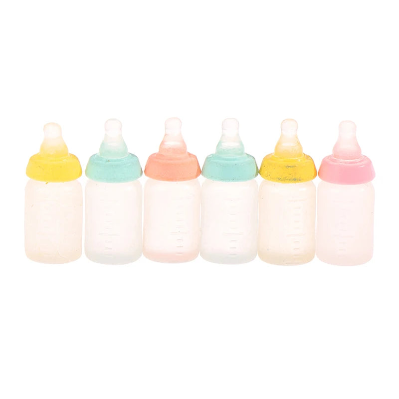 Colorful miniature baby bottle set for dollhouses, featuring pastel lids and realistic design for doll play.