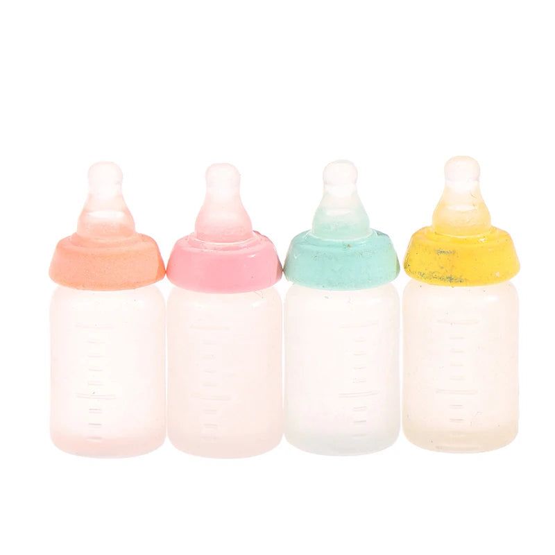 Colorful miniature baby bottle set for dollhouses, featuring pink, blue, orange, and yellow caps, perfect for collectors.