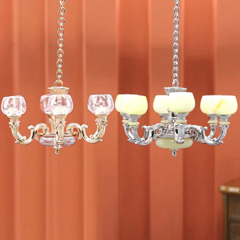 Elegant 1:12 dollhouse miniature chandeliers with gold and silver finishes, perfect for upscale model home decor.