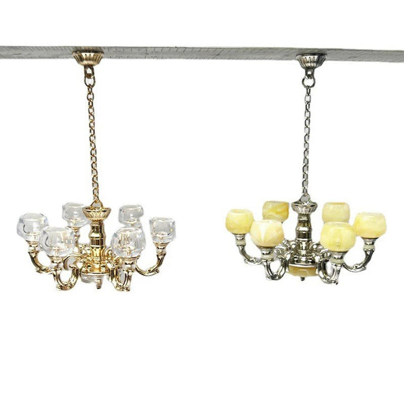 Elegant 1:12 scale dollhouse chandeliers in gold and silver with intricate glass detailing, perfect for miniature lighting.