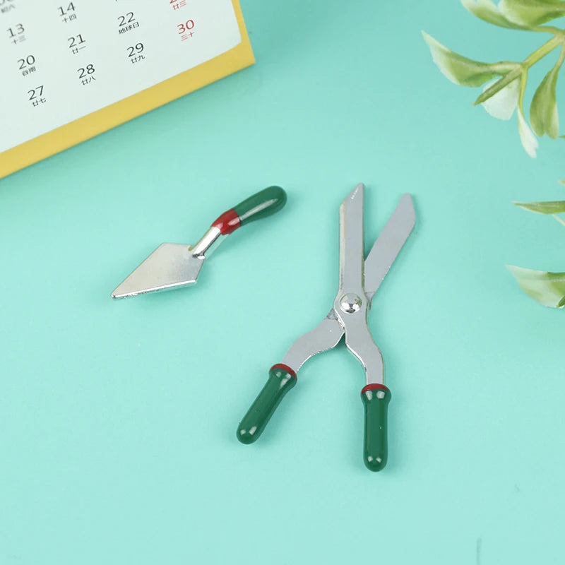 Miniature Gardening Tool Set with green-handled shears and trowel, perfect for small-scale horticulture projects.