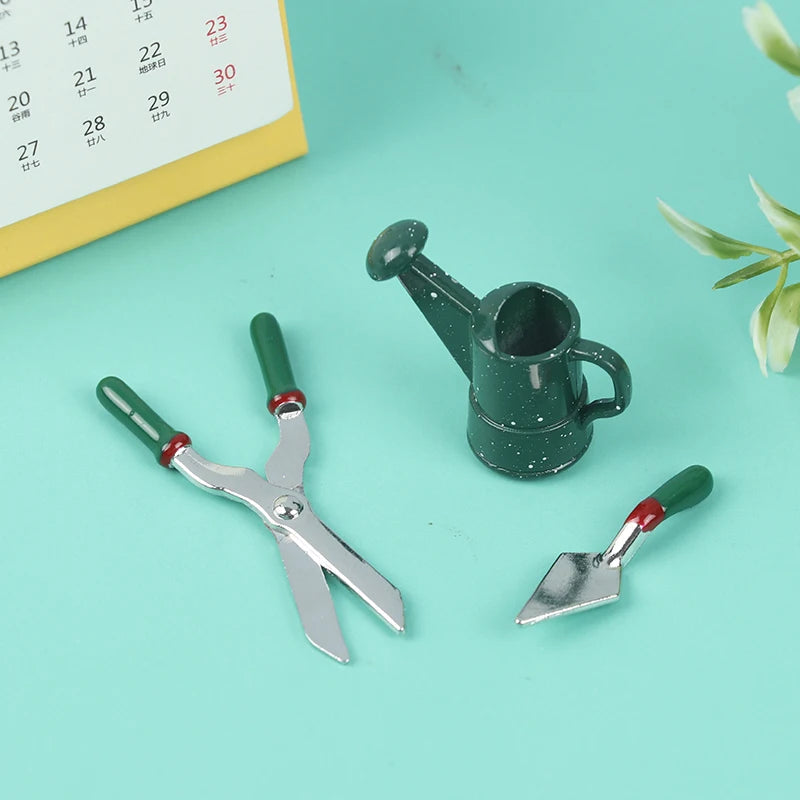 Miniature Gardening Tool Set with shears, trowel, and watering can, perfect for dollhouse garden enthusiasts.