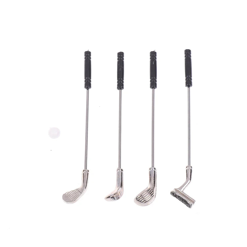 Miniature golf club set with four metal clubs and a tiny ball for dollhouse play, perfect for golf enthusiasts.