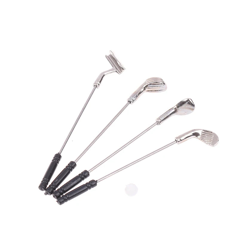 Miniature golf club set with four metal clubs for dollhouses, perfect for enhancing miniature sports scenes.