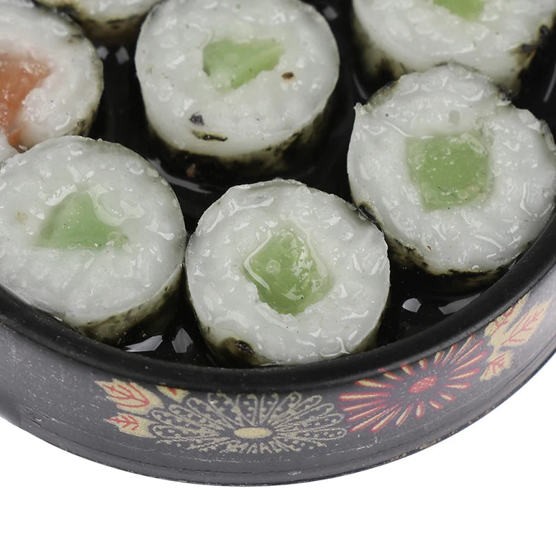 Miniature sushi rolls in a decorative black bowl, part of a detailed dollhouse Japanese sushi set. 🍣