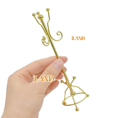Miniature golden coat rack for dollhouse, 1:12 scale, held in hand, perfect for iLAND dollhouse decor.