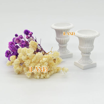 Miniature dollhouse urn planters with dry flowers, featuring elegant white design and vibrant purple and beige blooms.