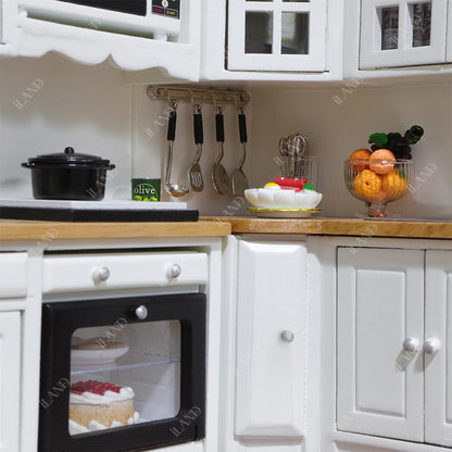 Modern iLAND dollhouse kitchen with white cabinets, miniature utensils, and wooden countertops on a 1/12 scale.