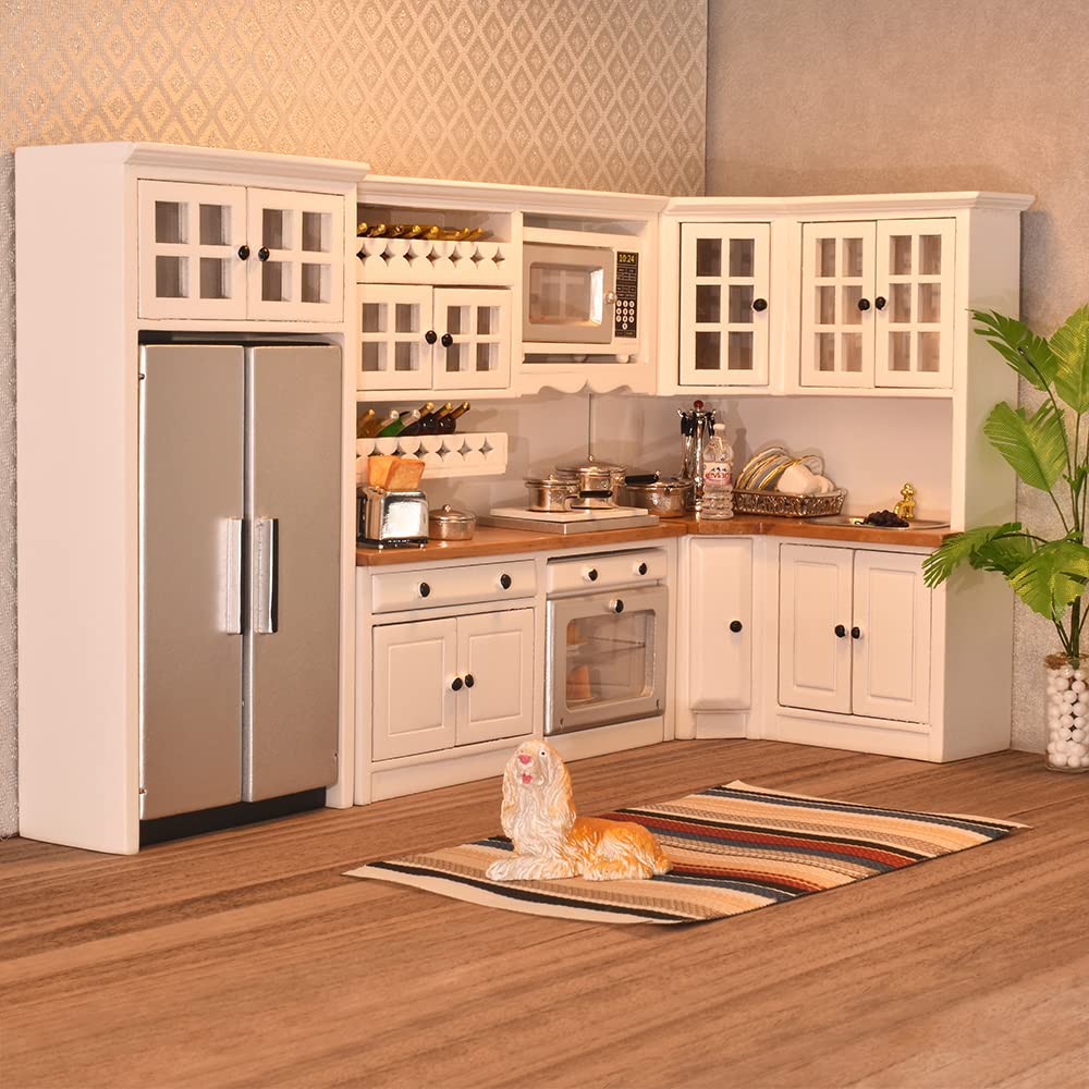 Modern 1/12 scale dollhouse kitchen with white cabinets, silver fridge, and accessories for miniature food storage.