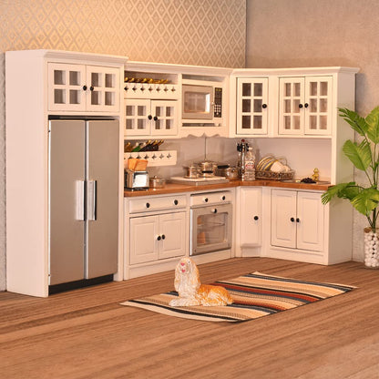 Modern 1/12 scale dollhouse kitchen with white cabinets, silver fridge, and accessories for miniature food storage.