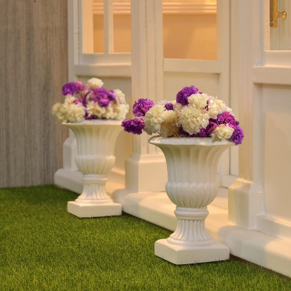Miniature dollhouse urn planters with vibrant purple and white dry flowers, enhancing a realistic garden display.
