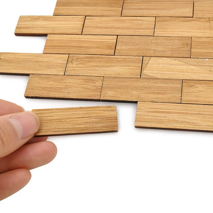 Bamboo dollhouse flooring tiles in 1:12 scale, showing a hand placing a varnished rectangular piece, perfect for miniatures.