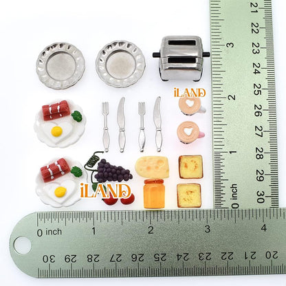 Miniature dollhouse breakfast set with plates, utensils, toaster, cheese, grapes, and sunny-side eggs, next to a ruler.