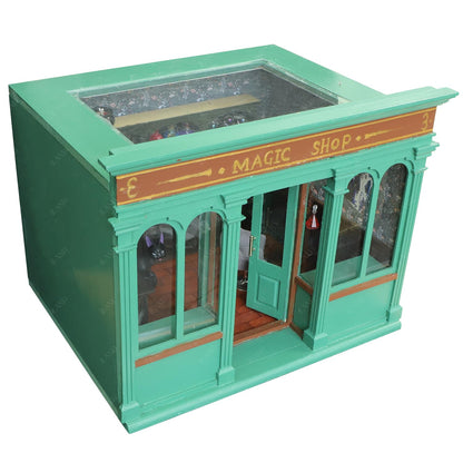 Miniature 1/12 scale magic shop dollhouse with green facade, ideal for crafting creative wooden room boxes.