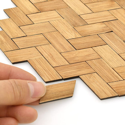 Hand placing iLAND varnished bamboo dollhouse flooring, 1:12 scale, showcasing intricate rectangular pattern, 96 pieces set.