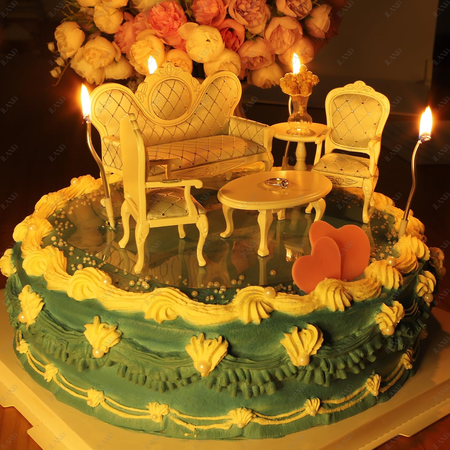 Victorian dollhouse furniture set on decorative cake, featuring sofa, chairs, and table with romantic ambiance.