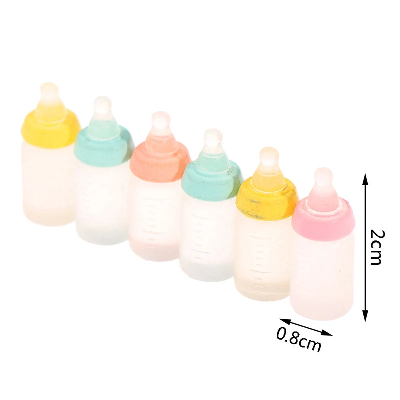 Colorful miniature baby bottle set for dollhouses, featuring pastel lids and realistic design, perfect for doll play.