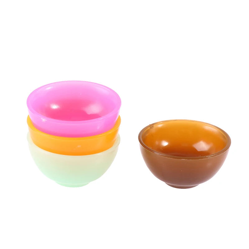 Colorful miniature dollhouse bowl set with pink, orange, mint, and brown bowls, perfect for creative play and decoration.