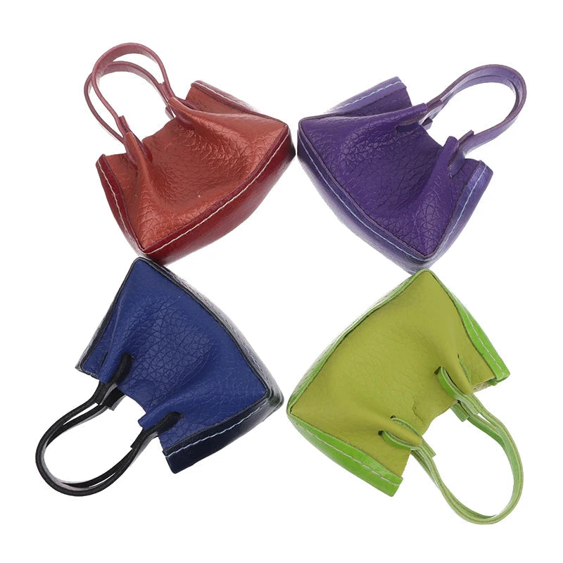 Colorful Miniature Dollhouse Handbags in red, purple, blue, and green leather. Perfect for collectors and decor enthusiasts.