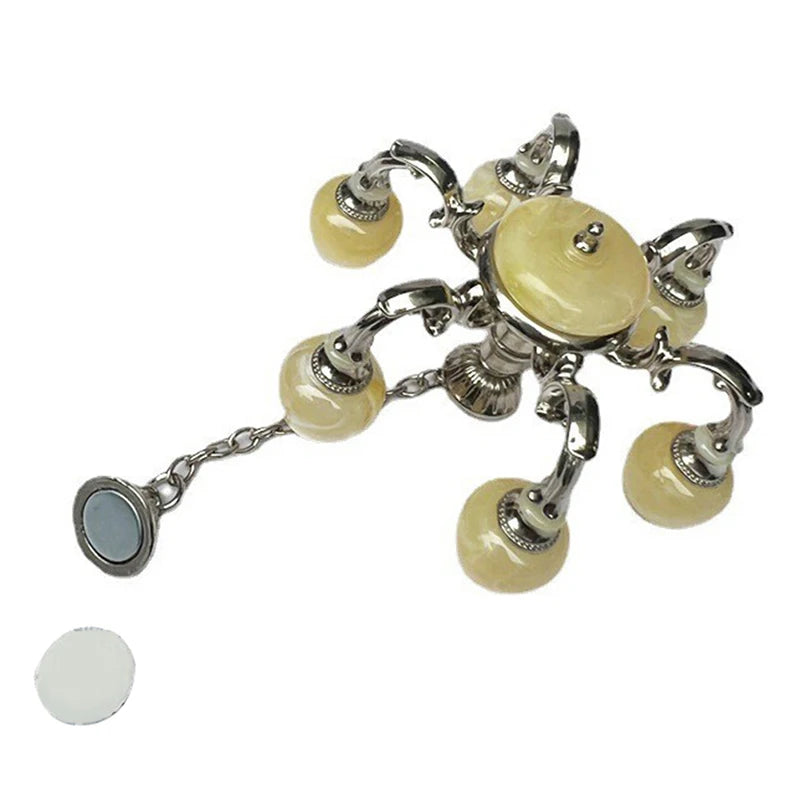 Elegant 1:12 dollhouse chandelier with six glass globes, perfect for miniature home decor and lighting ambiance.