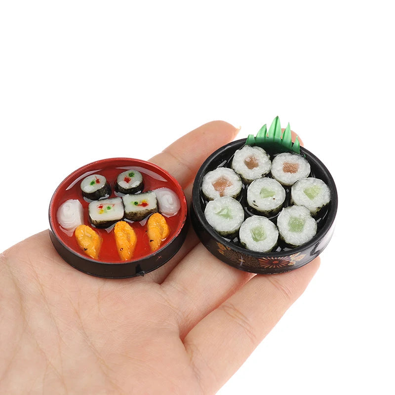 Miniature Japanese sushi set with assorted rolls and nigiri in a hand, perfect for dollhouses and collectors.