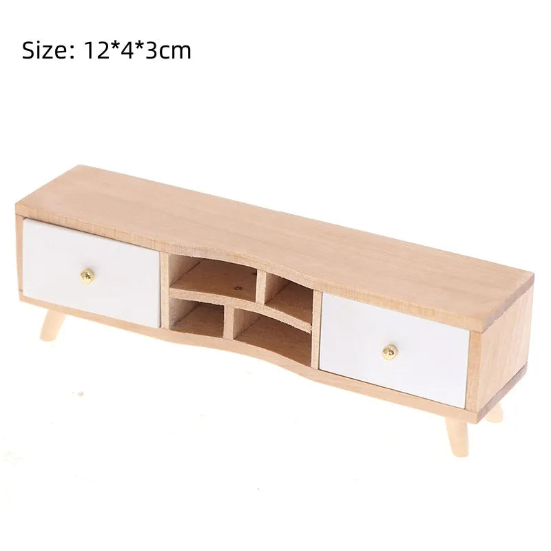 Miniature wooden TV stand with two drawers, 1:12 scale, perfect for dollhouse decor, measuring 12x4x3 cm.