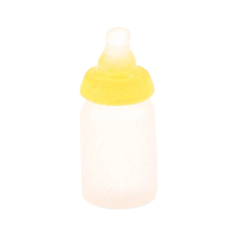 Miniature yellow-capped baby bottle for dollhouse play, perfect for realistic nursery scenes.